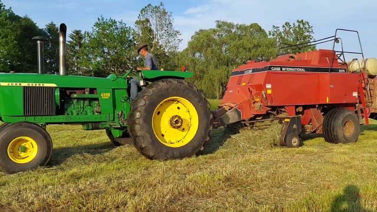 Making dry grass hay in big bales