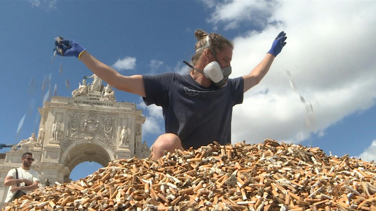 Climate activists heap up 650,000 cigarette butts in Portugal | AFP