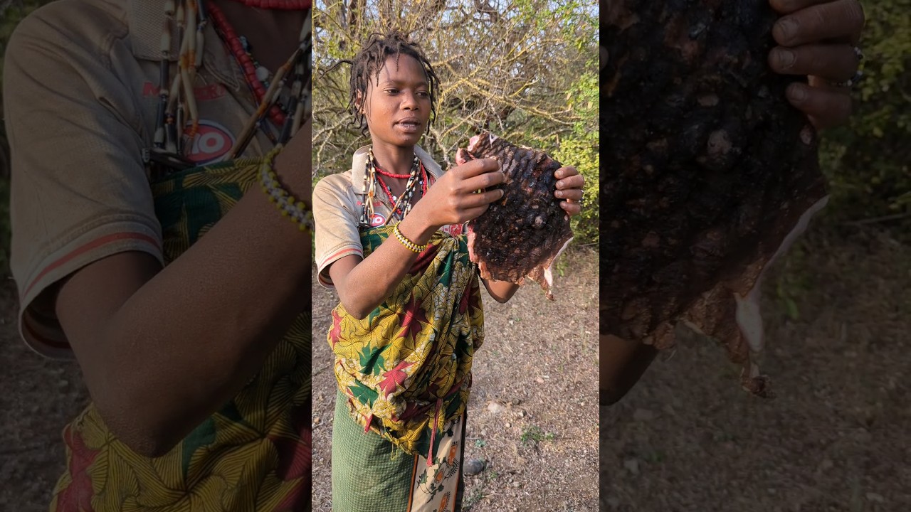 Beautiful Woman hadzabe hunt's tribe prepare their lunch time