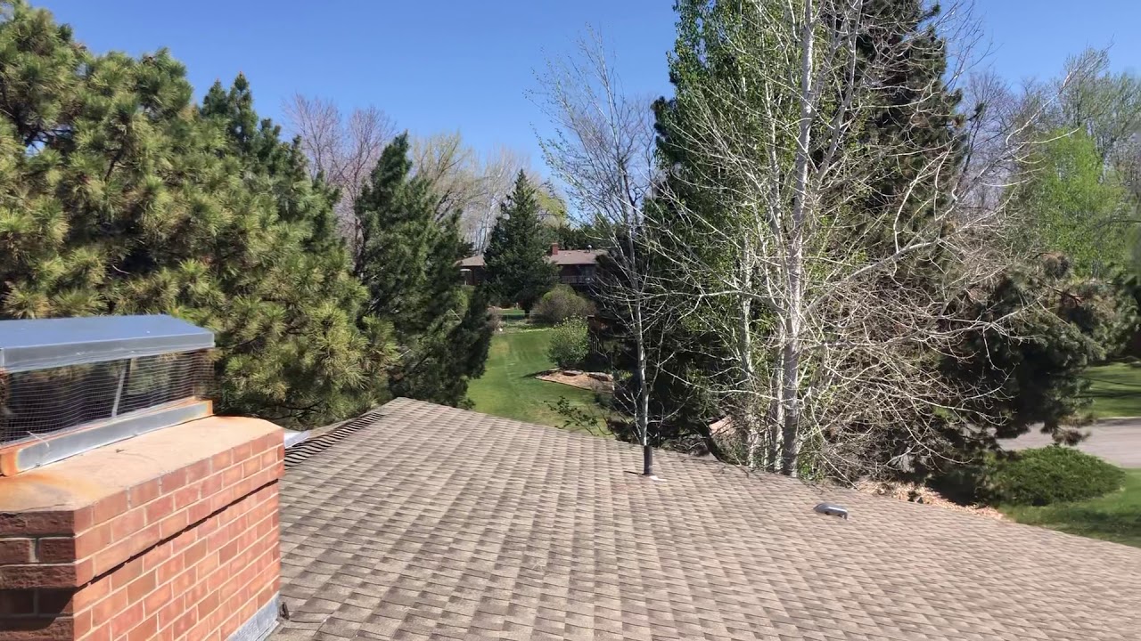 Inspecting a Roof with a Drone After a Hail Storm. M & E Roofing Solutions.