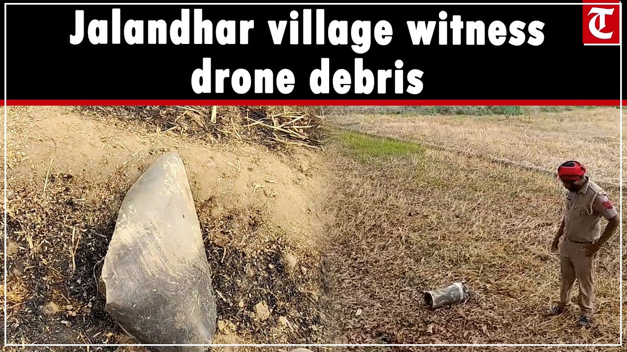 Anxious villagers of Uccha Pind near Jalandhar after debris of Pakistan drone found in fields