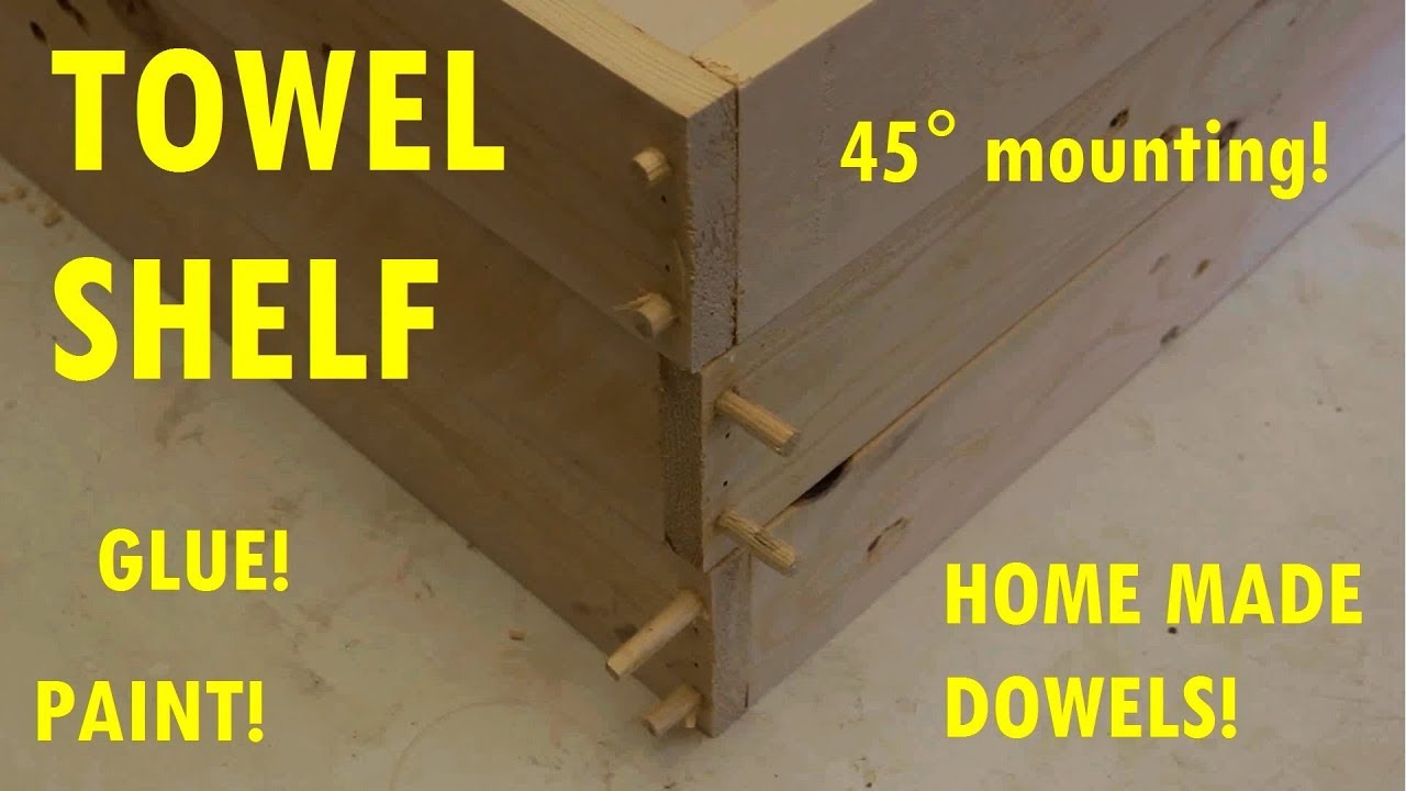 Pallet wood build: Towel rack with hammered dowels and watered down paint