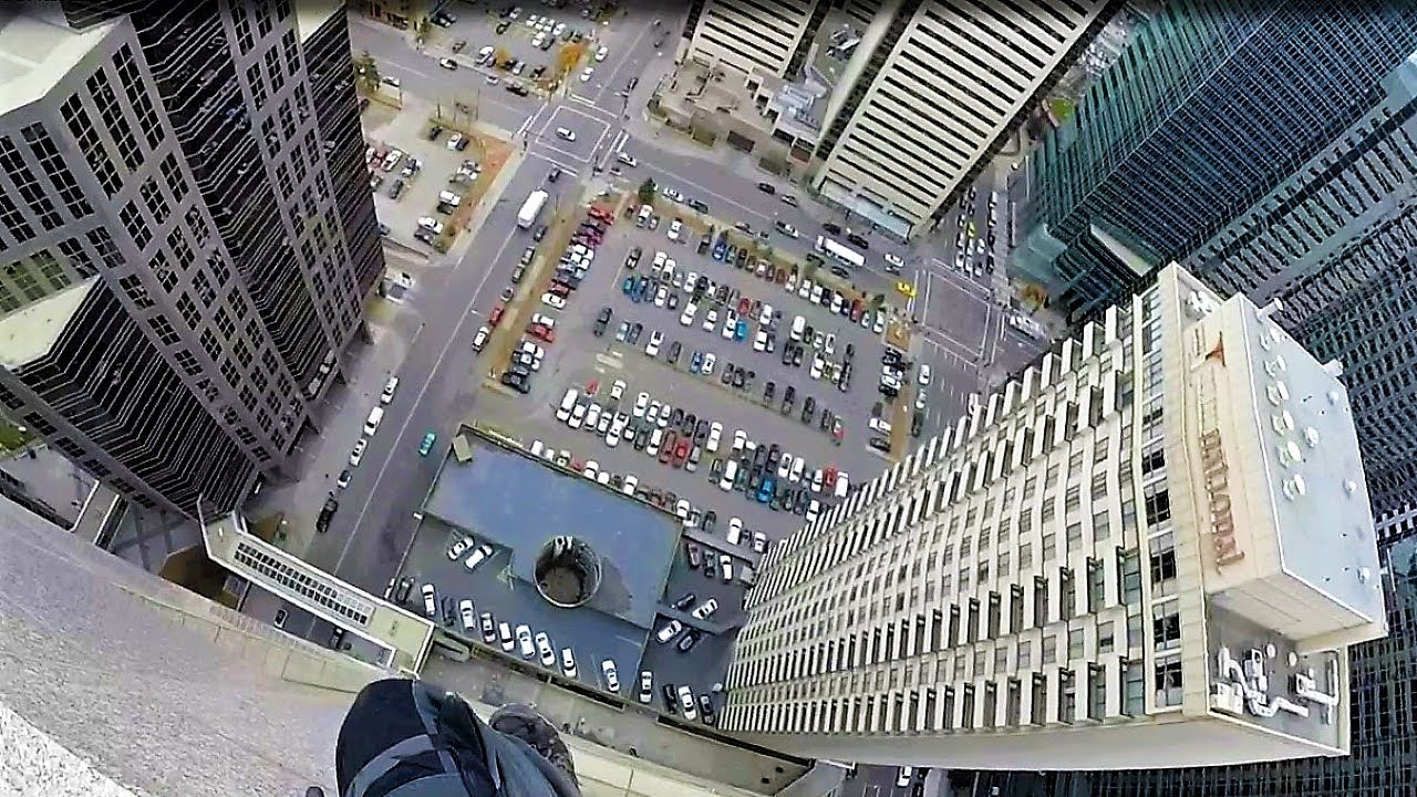 Rope access window cleaning 35 story building with rigging.