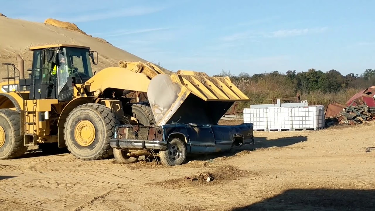 Cat 980 loader crushing a pickup