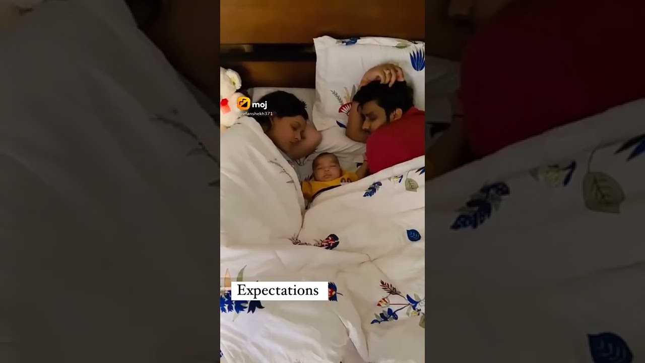 Cute baby's playing at night while sleeping mom and dad.How cute baby.