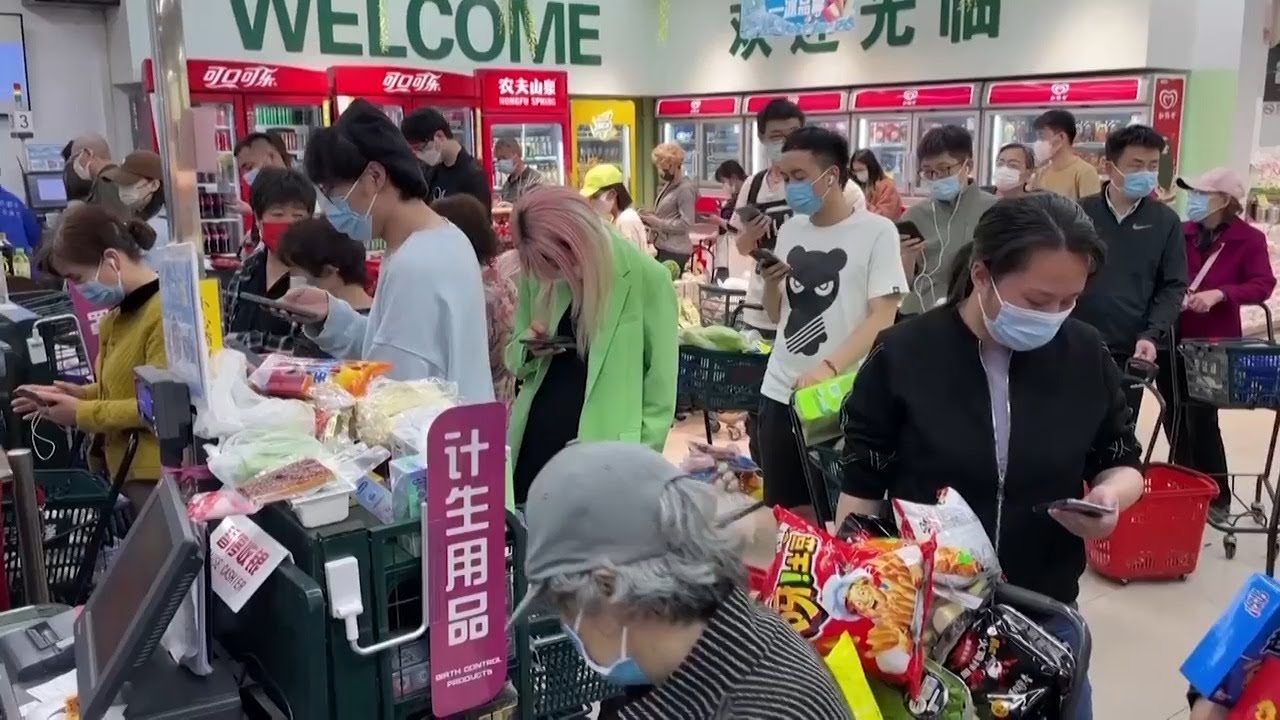 Beijing shoppers stock up as city begins mass COVID testing