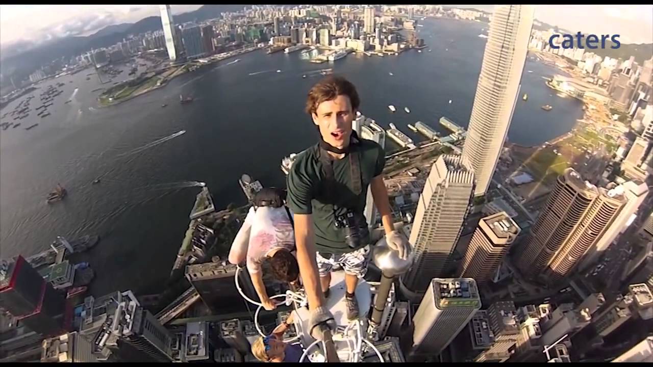 extreme selfie on top of Hong Kong skyscraper