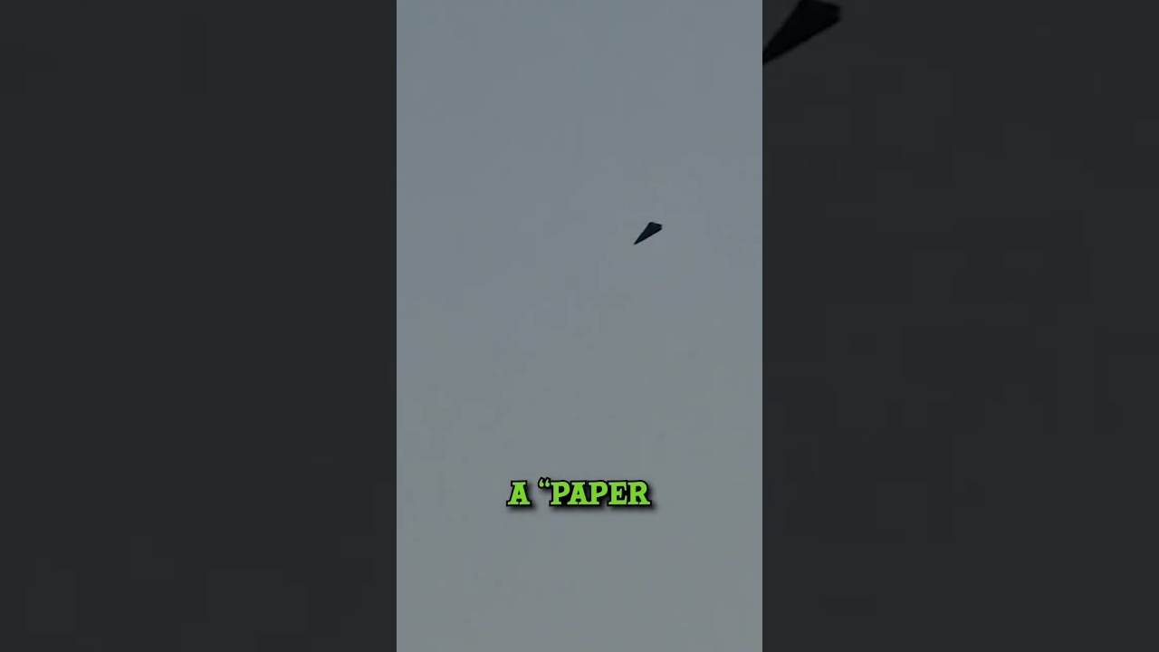Strange Black Triangular UFO Filmed Floating Over City in Germany 