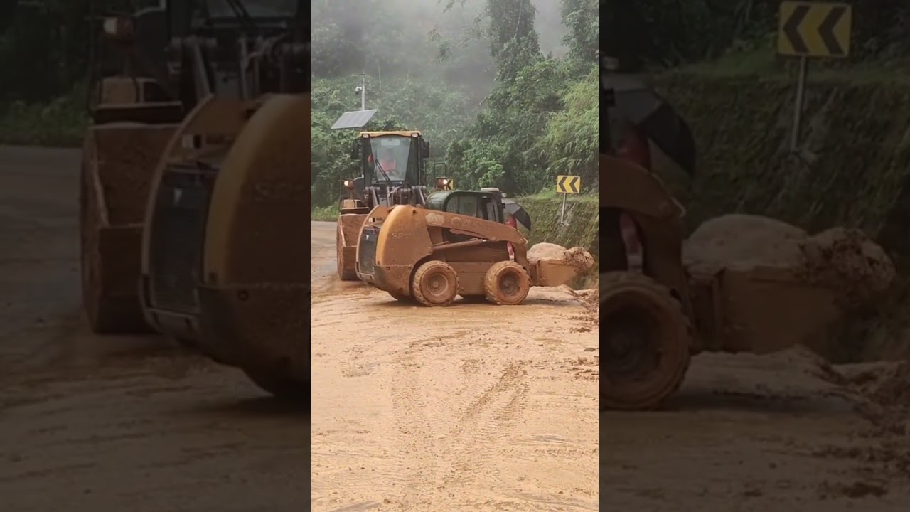 Heavy Excavator Clearing Thick Mud from Roadside