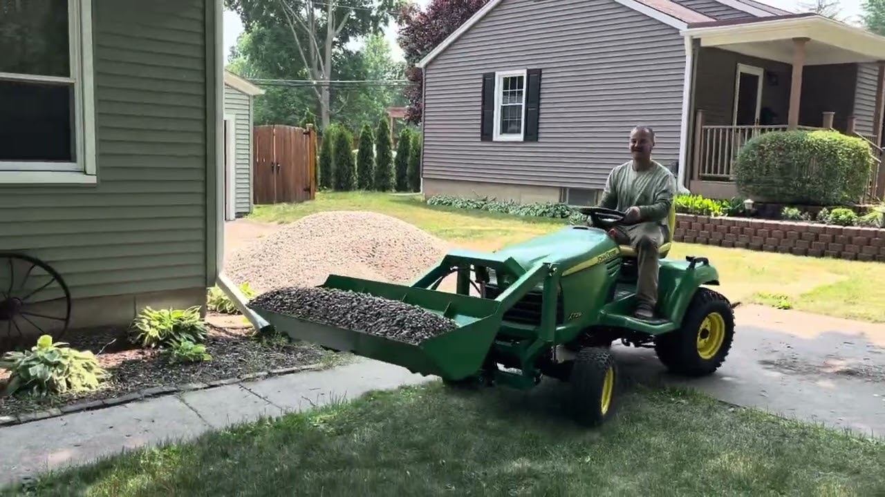 FEL moving river rock on JD x729