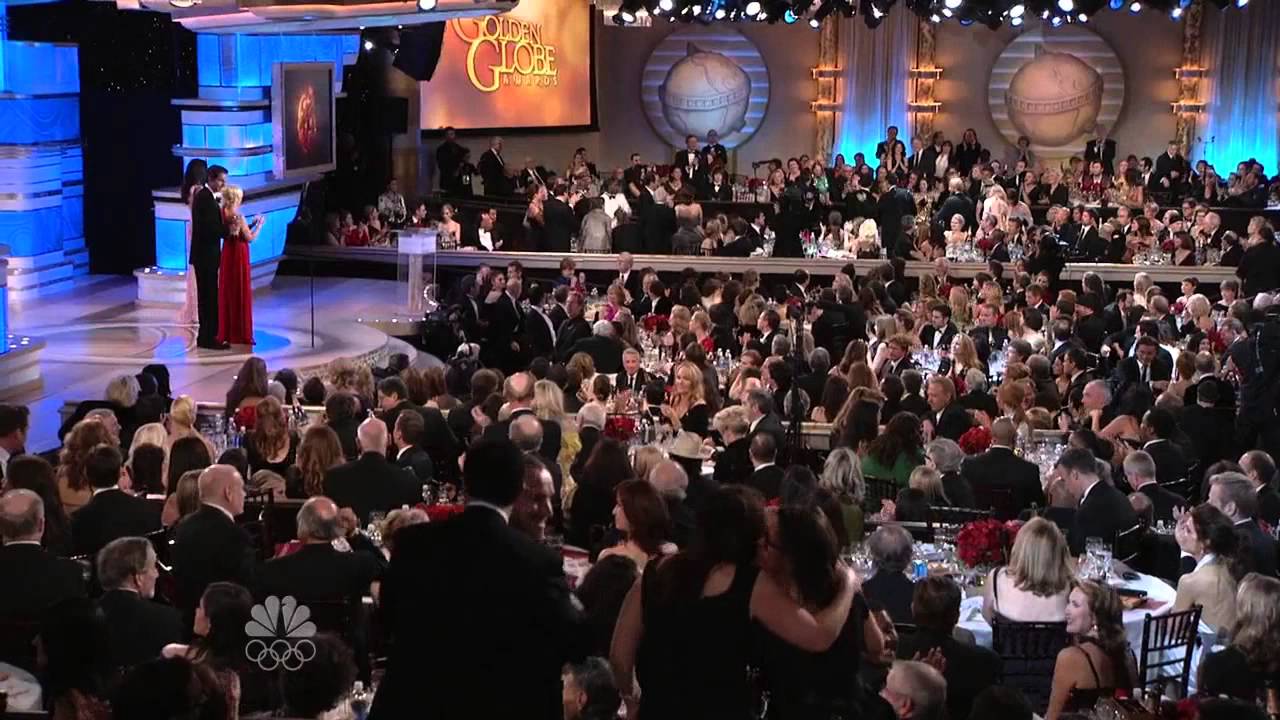 Zachary Levi and Amy Poehler presenting at the 2010 Golden Globes