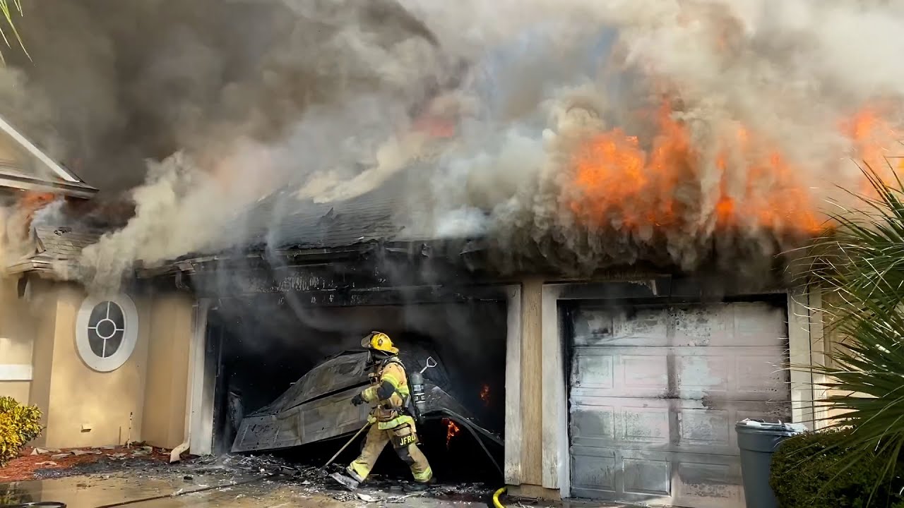 The Jacksonville Fire Rescue Department is forced to go defensive after fire gets into the attic.