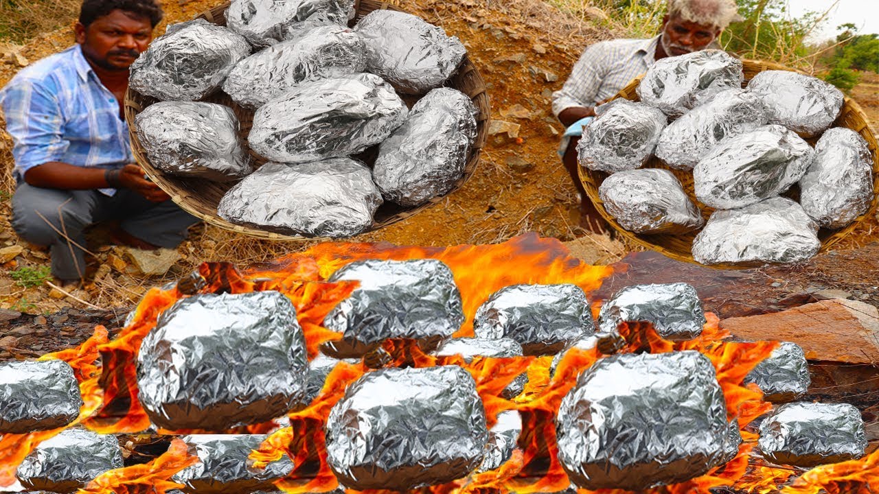 Roasted whole Chicken in Traditional Way/Grilled chicken in aluminium foil paper/food fun village