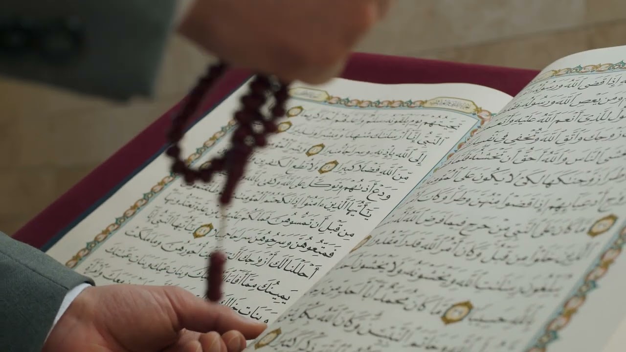 Islamic Background Video No Copyright | A Man Turning Pages Of Quran While Praying With Prayer Beads