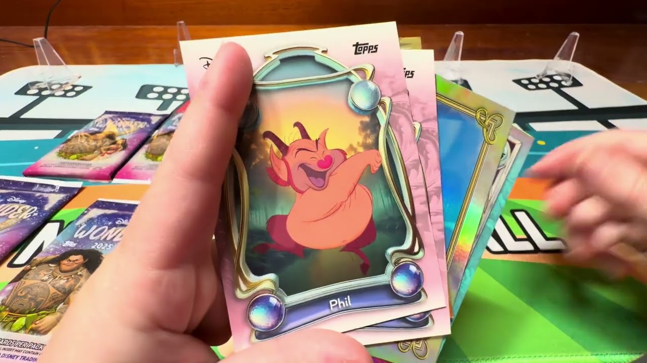Nora opens a pack of Disney wonder
