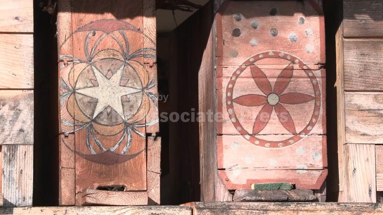 The artist creating a buzz by decorating beehives with traditional motifs