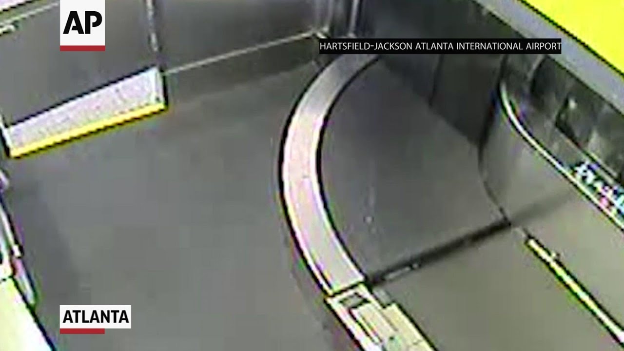 Toddler takes wild ride on airport luggage belt
