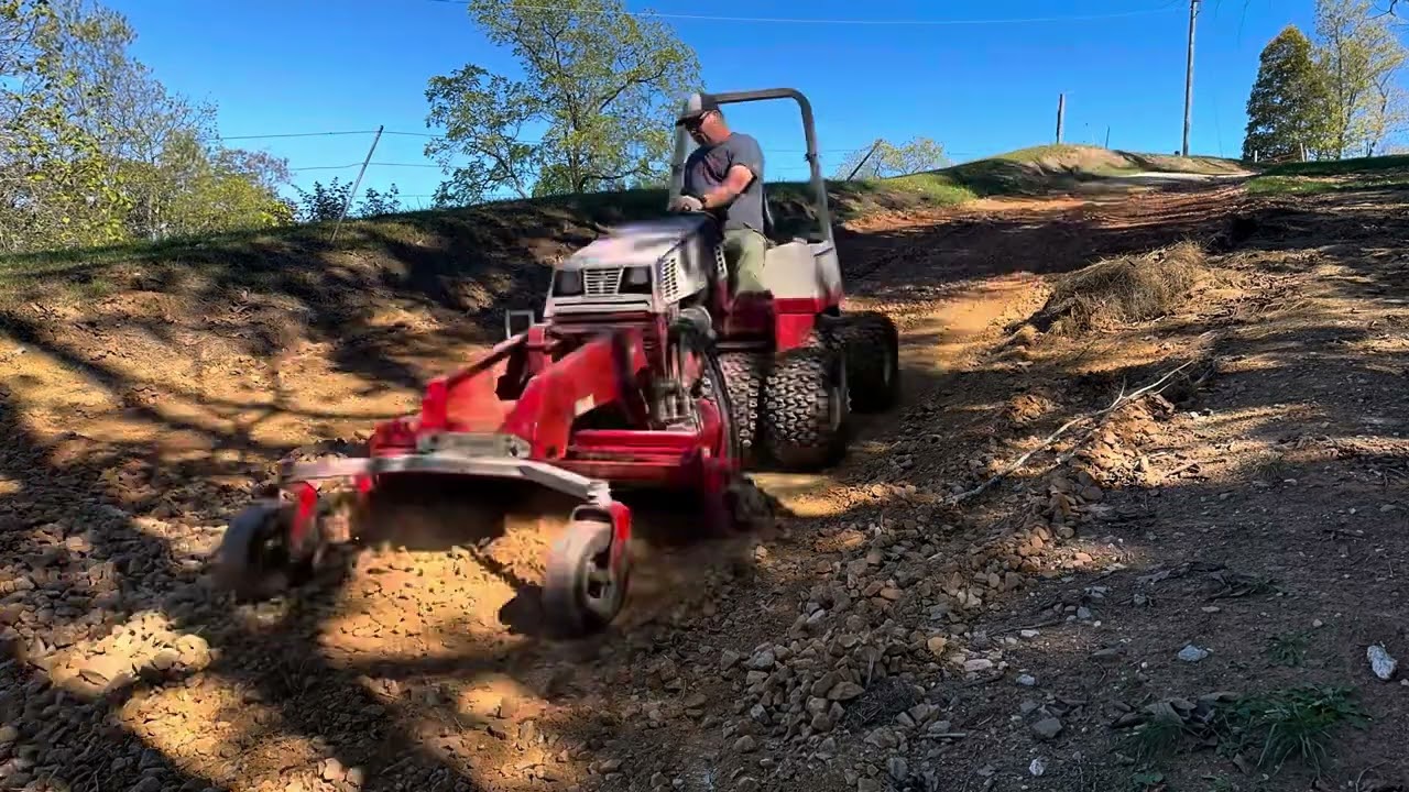 Quick video using my Ventrac power rake, on a large steep driveway repair.