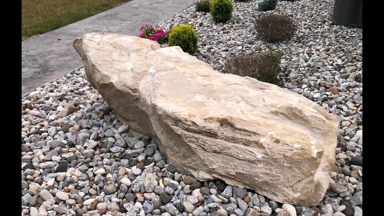 #19, Cleaning a large rock with muriatic acid and placing it into the landscaping.