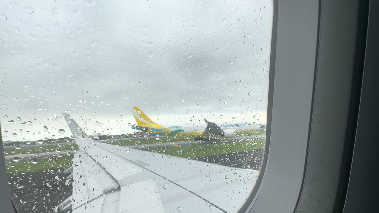Philippine Airlines overcast noon departure from Manila