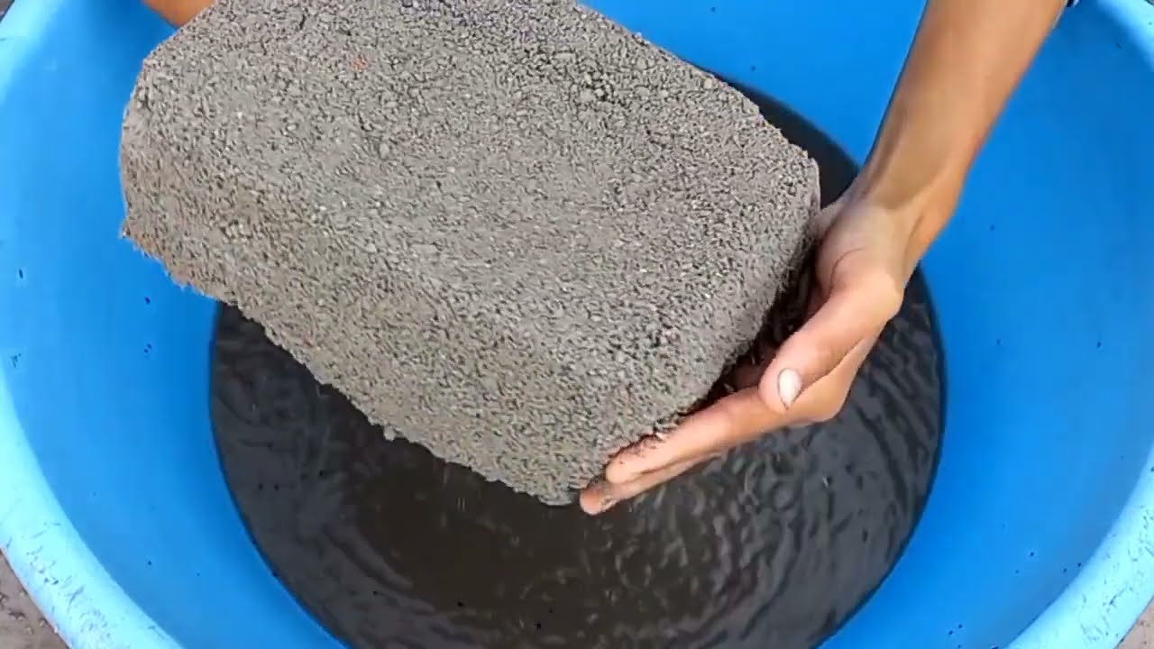 Huge Slabs of Black concrete crumbling in lots of Water with mixing asmr