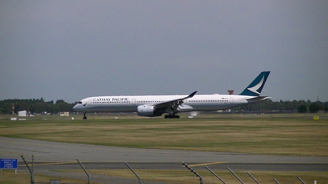 cathay pacific makes an amazing depature on a windy day from christchurch airport