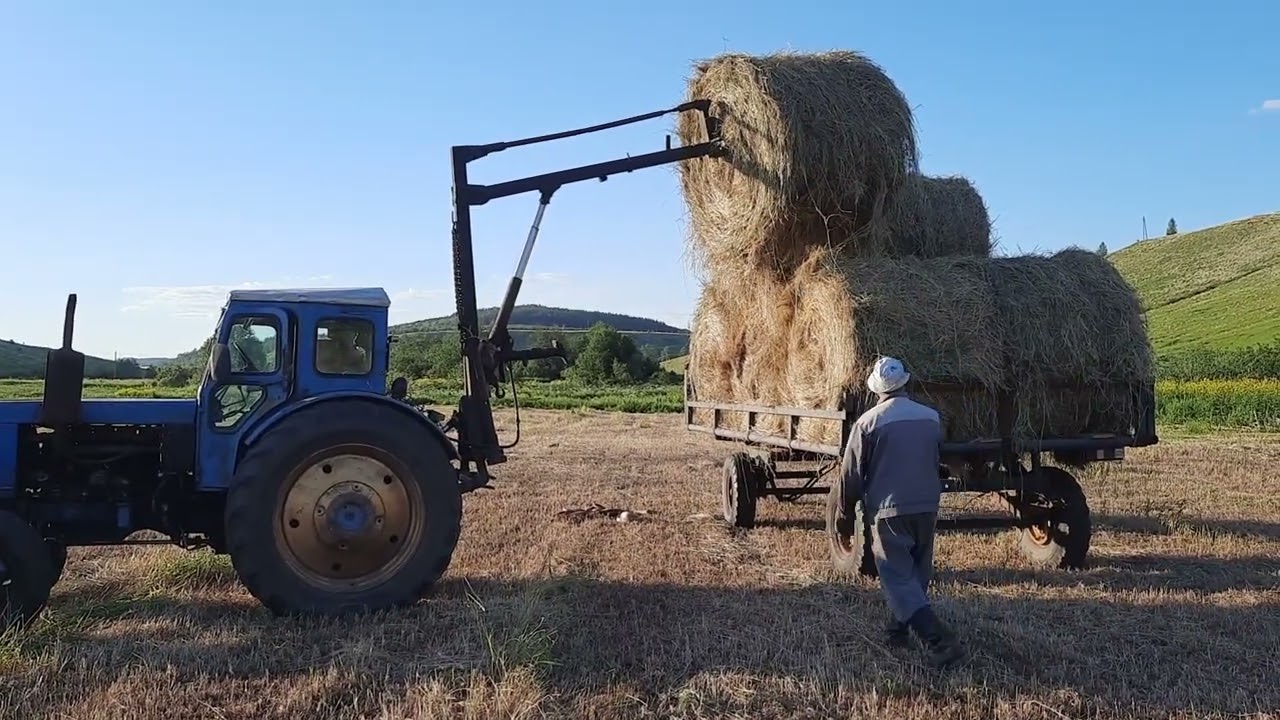 Испытание прицепа и пики для погрузки сена в рулонах