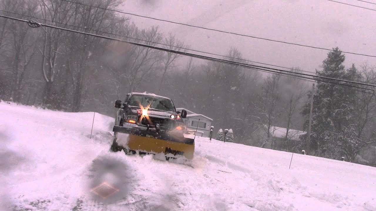 Meyer Lot Pro Plowing the Snow Off a Driveway with Ford F250