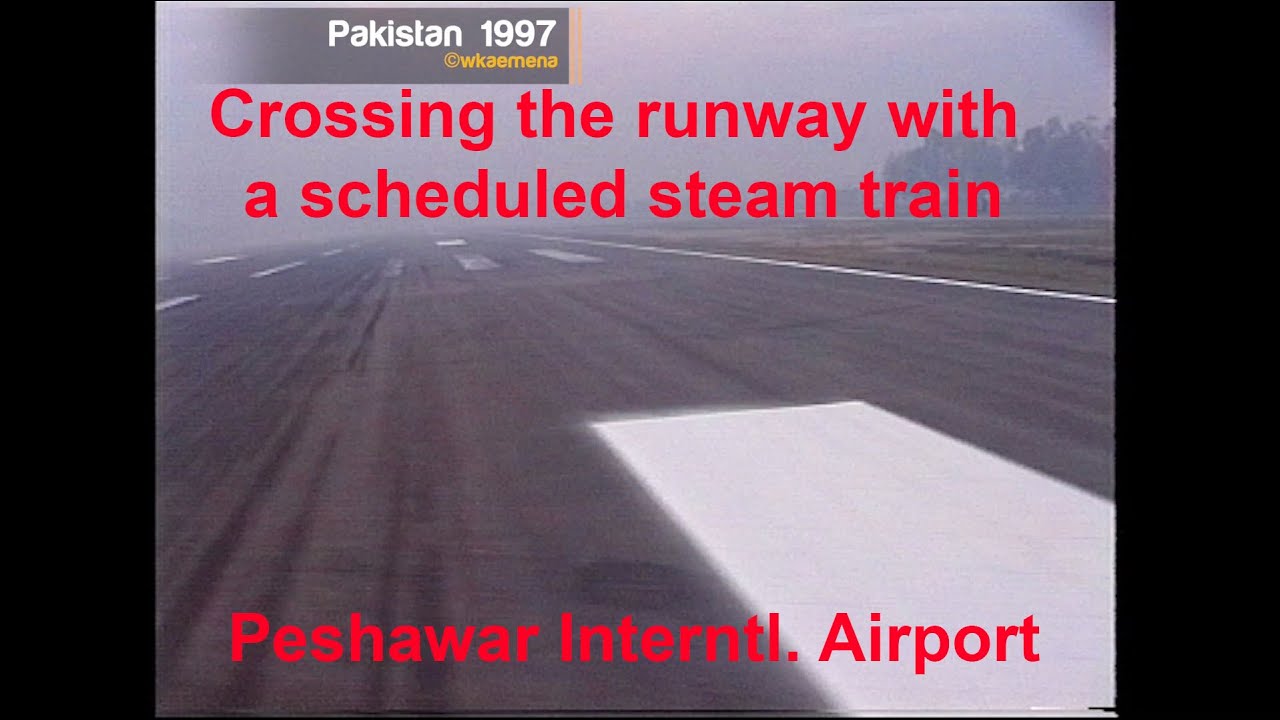 1997 Steam Train crosses runway of interntl. Airport Peshawar Pakistan