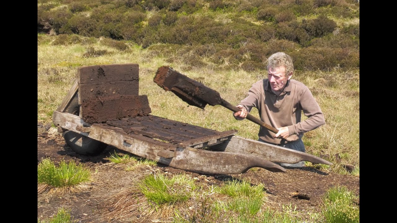 Traditional Cutting Peat and Turf in a bog in Ireland