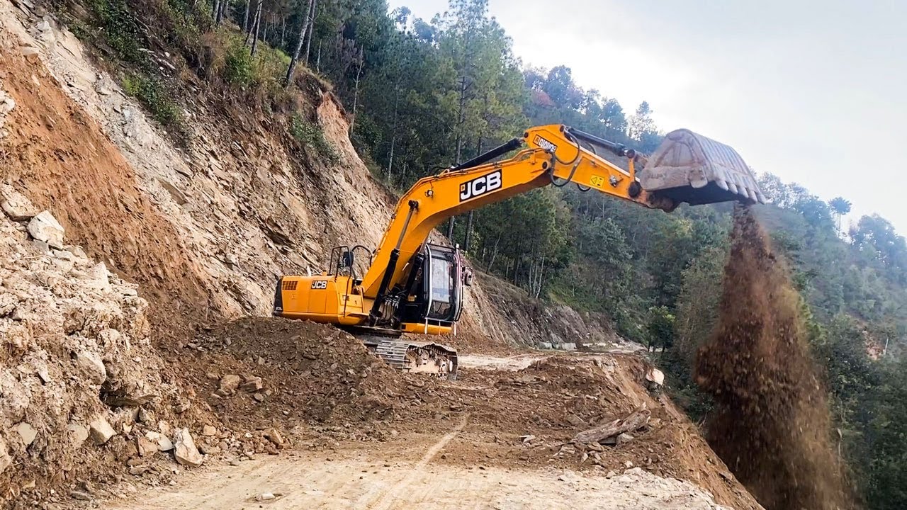 Skillful Excavator Operator Building Mountain Road, Clearing Landslide