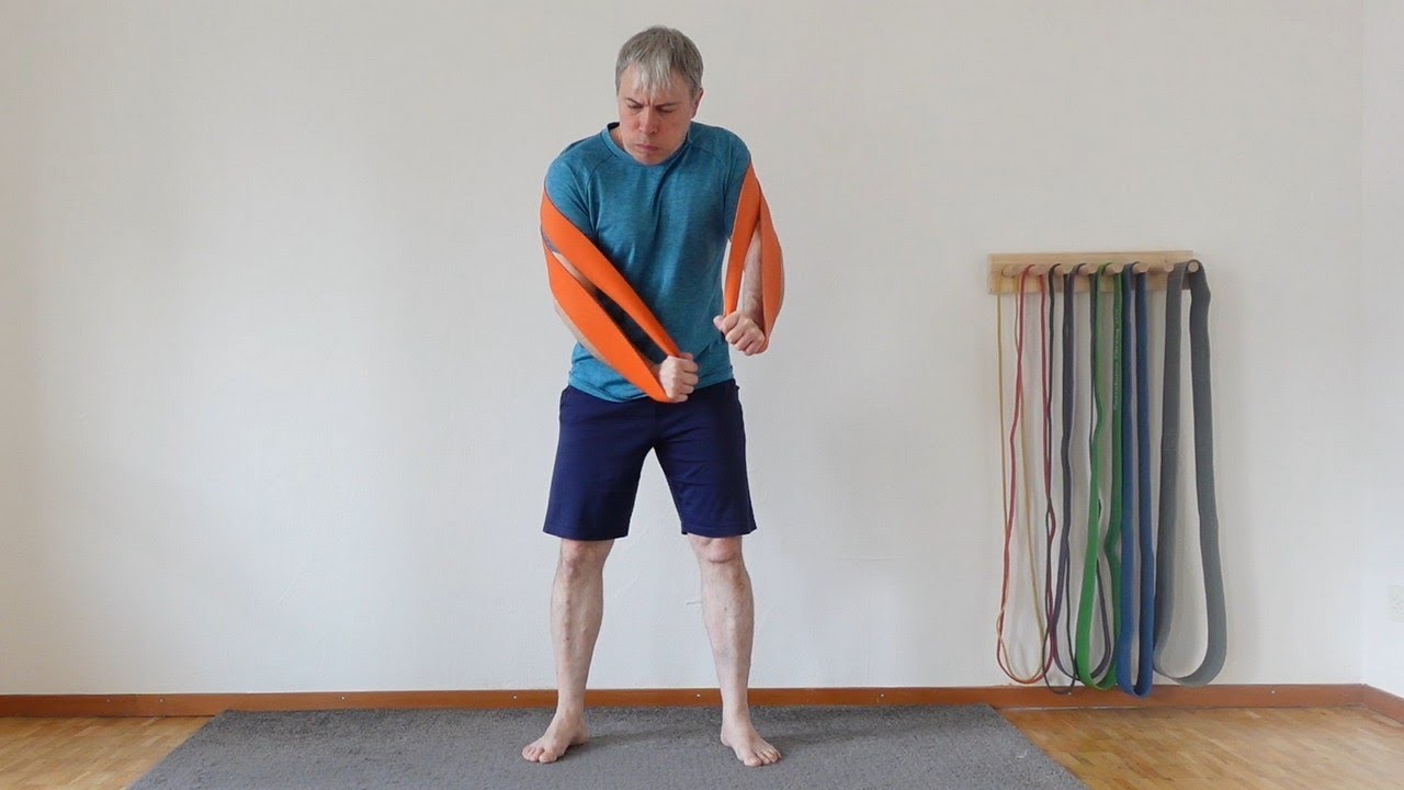 Build chest and triceps with resistance band low press-arounds