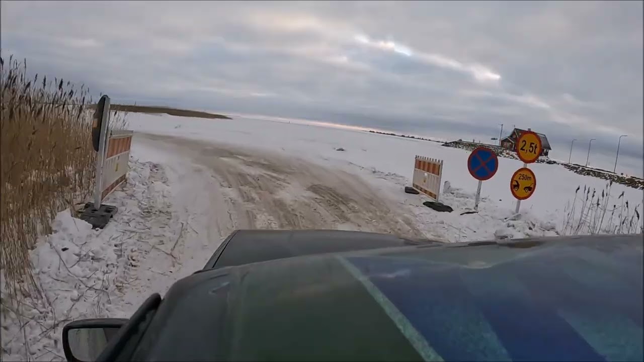 Driving on Estonian ice road across frozen Baltic sea to Vormsi island