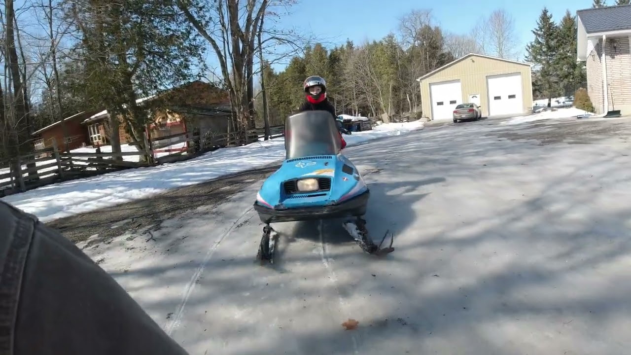 Polaris Star Snowmobile riding with shorts on