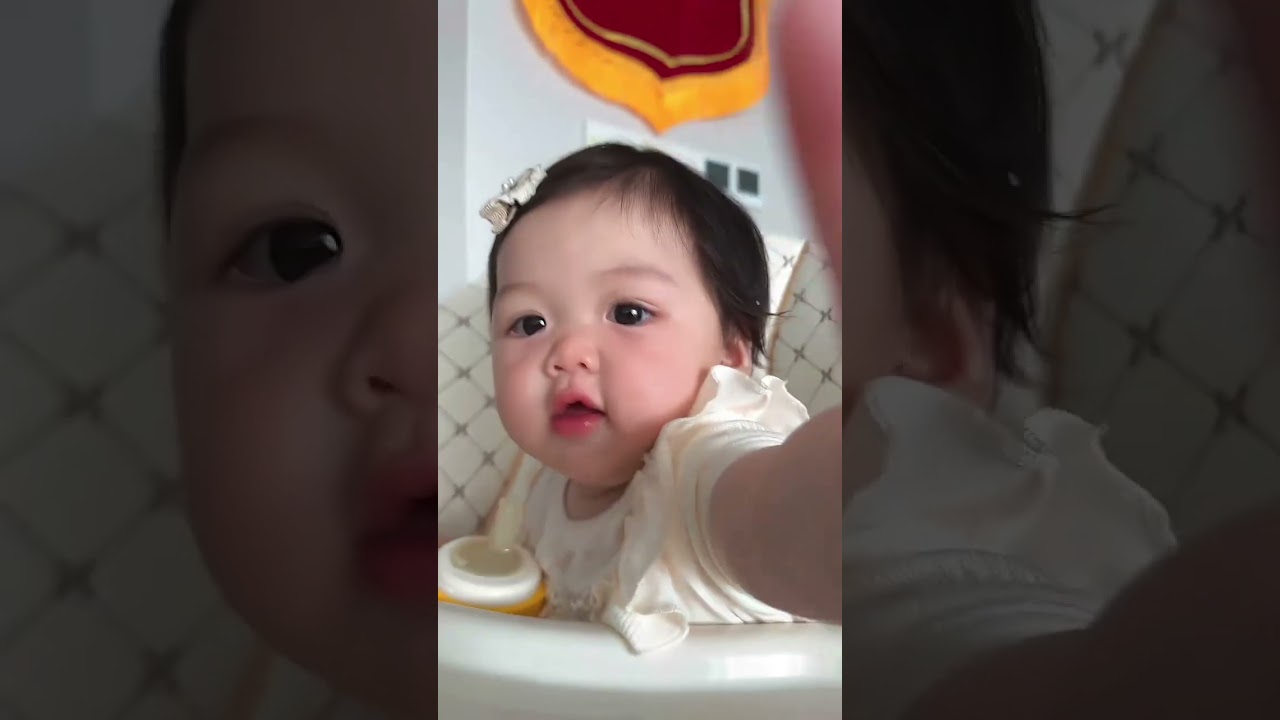 Girls are born with a sense of camera, right? Human cubs are the first time they use a learning cup.