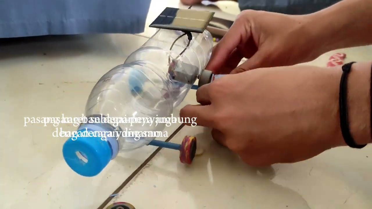 PRAKTIKUM FISIKA MEMBUAT MOBIL TENAGA SURYA KELAS XII. 1 KELOMPOK 5
