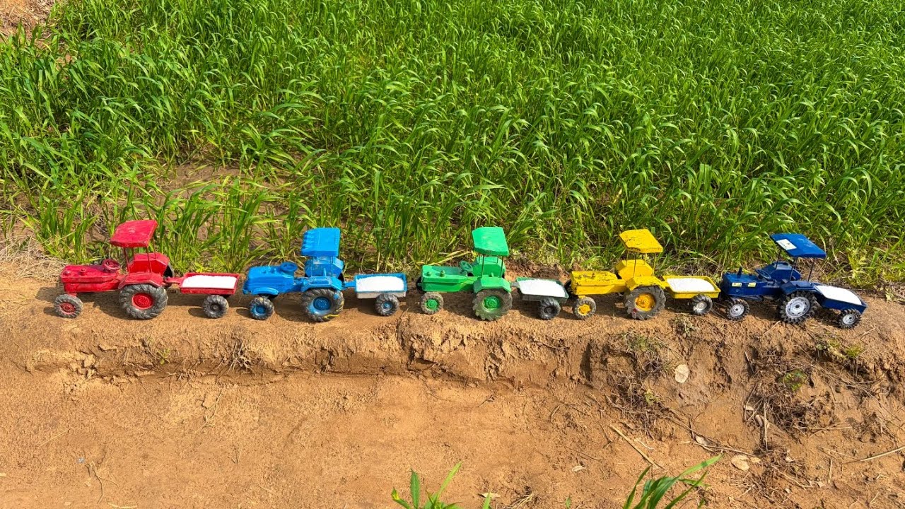 The fertilizer was applied to the field, having been loaded from the tractor's trailer.#157