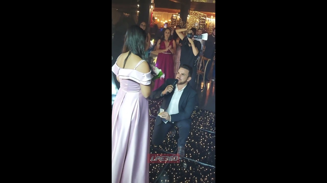 Bride gives bouquet to bridesmaid proposal