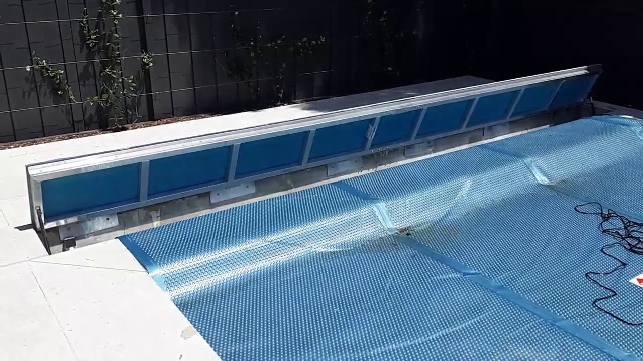Aussie UnderCover® POWERED - hidden underground pool cover system -   roll away