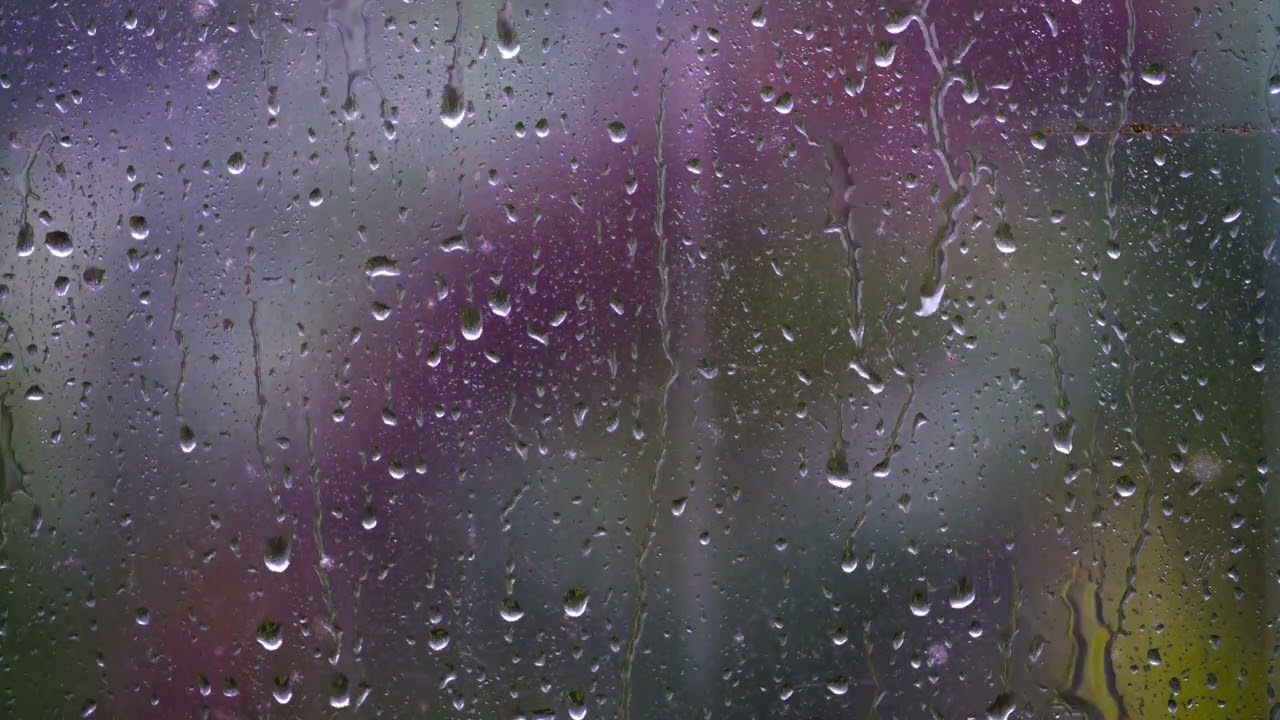 A close-up shot of rain droplets on a window in Bali #relaxation #rainsounds #rainsoundsforsleeping