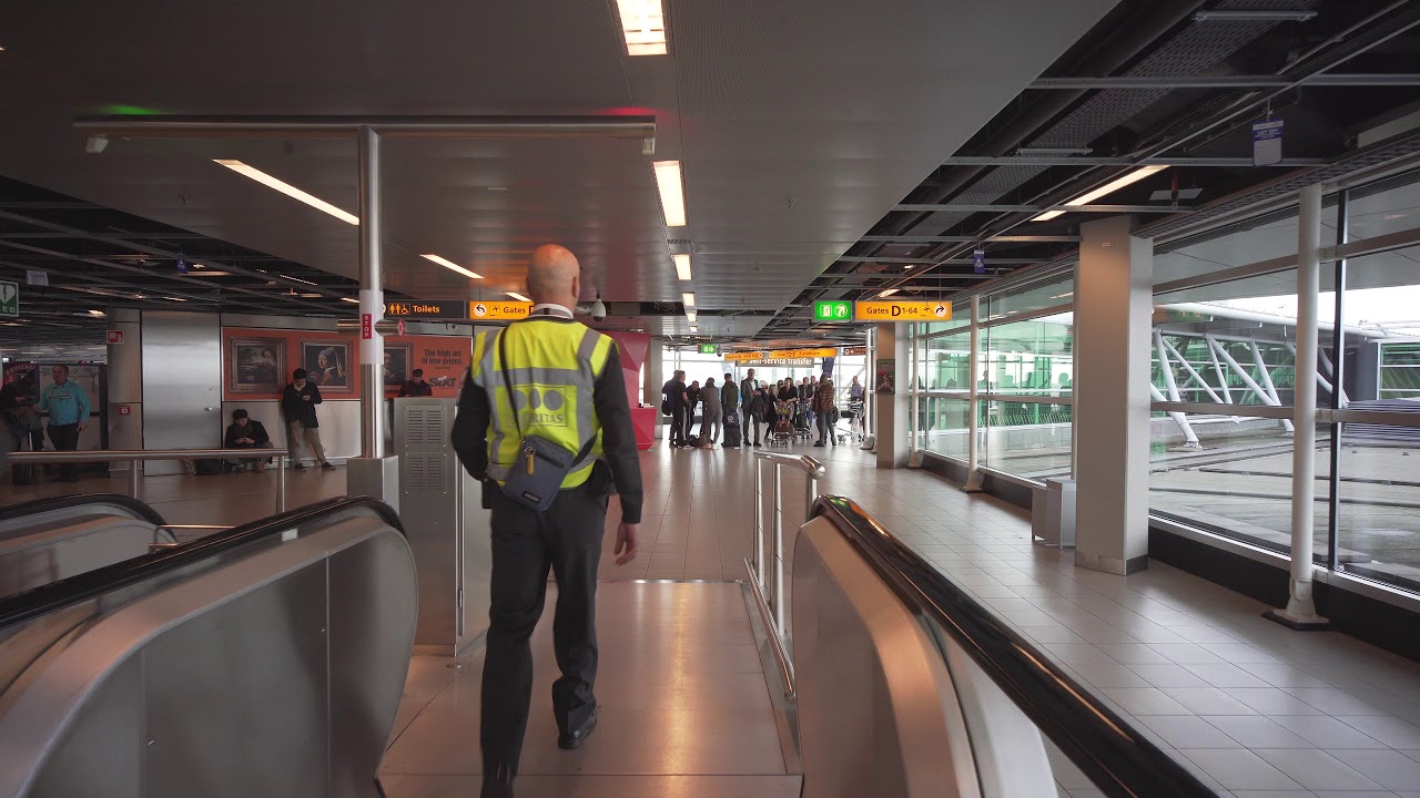 Netherlands, Schiphol Airport, arriving with Transavia from Naples, 2X escalator, 4X moving walkway