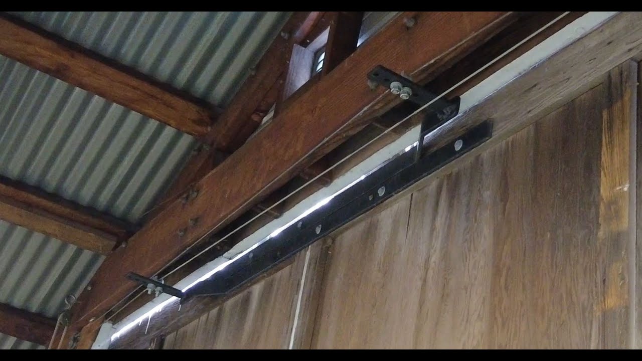 Boathouse automatic barn door system.