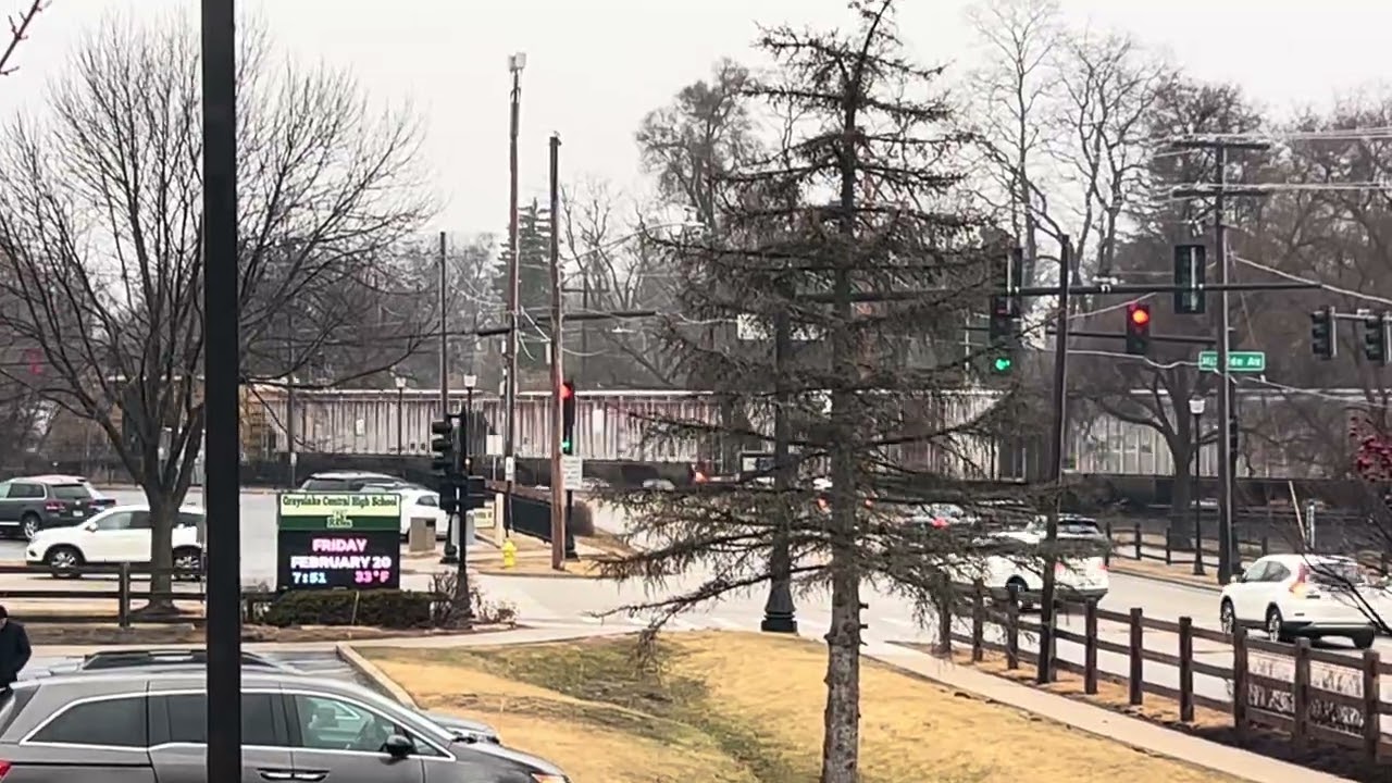 CN 3130 leads a hopper train through Grayslake 