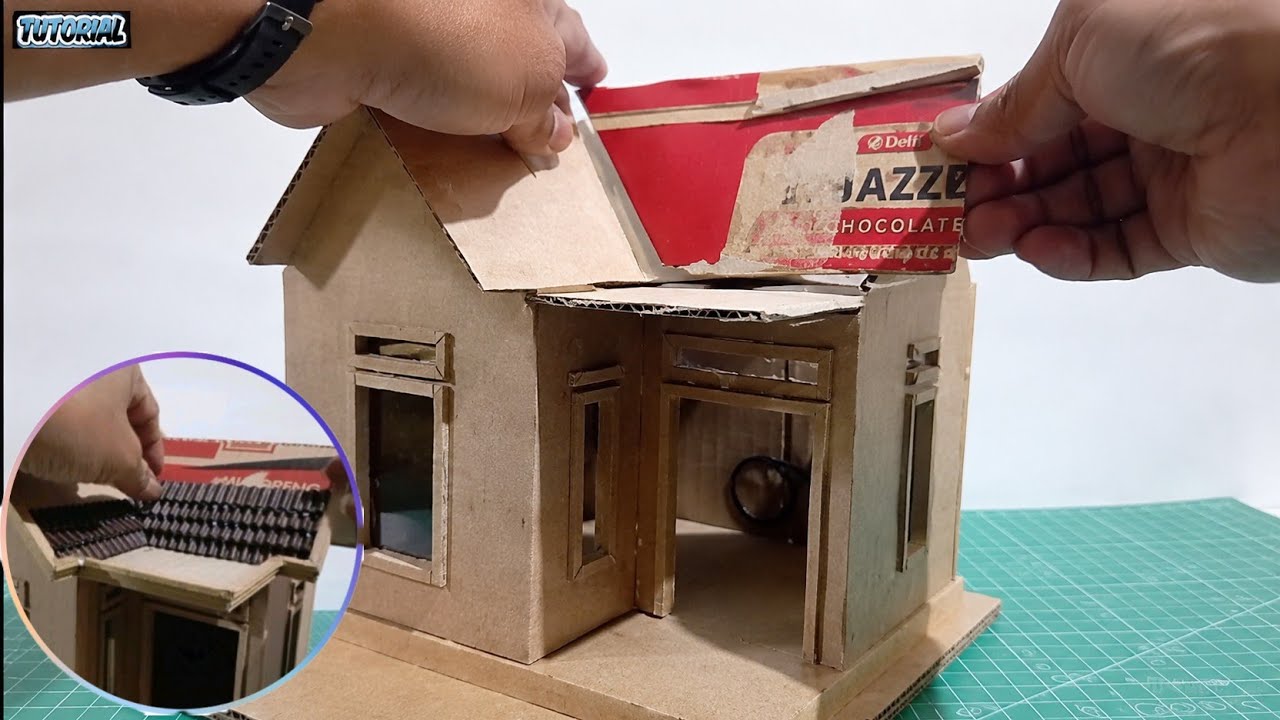 making a miniature house from used cardboard.