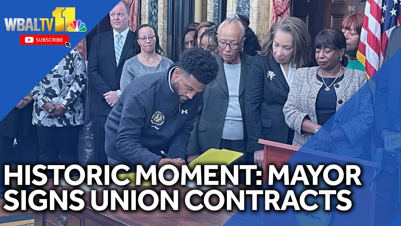 Mayor signs union contracts in historic moment for city