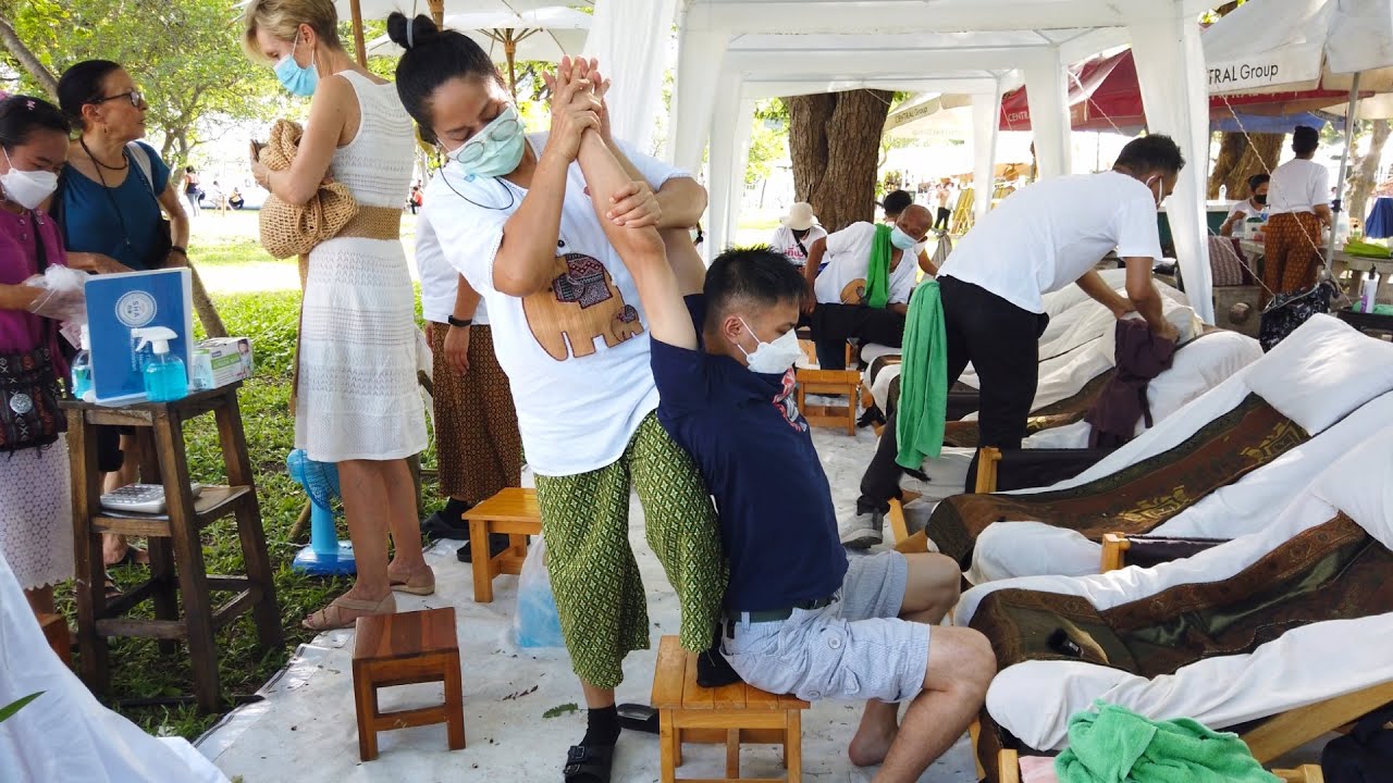 Outdoor THAI STREET MASSAGE at Lumpini Park Bangkok, Thailand