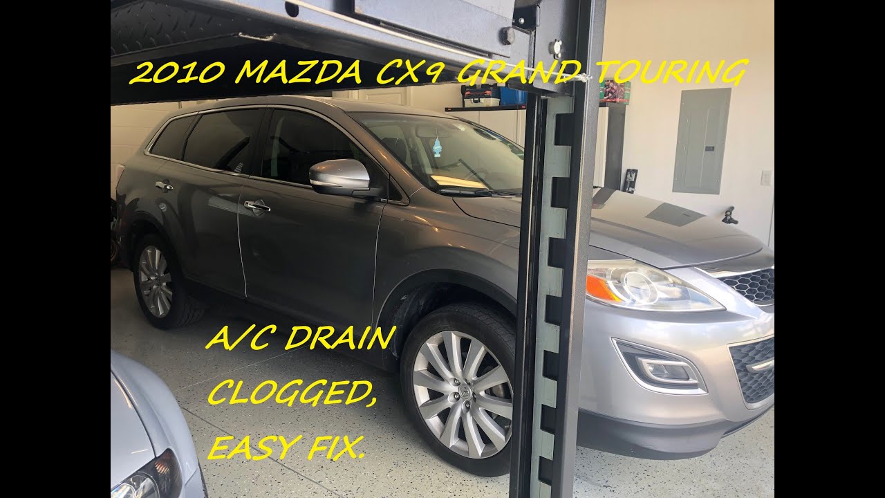 Mazda CX9 Grand Touring, A/C drain is clogged. Easy repair.