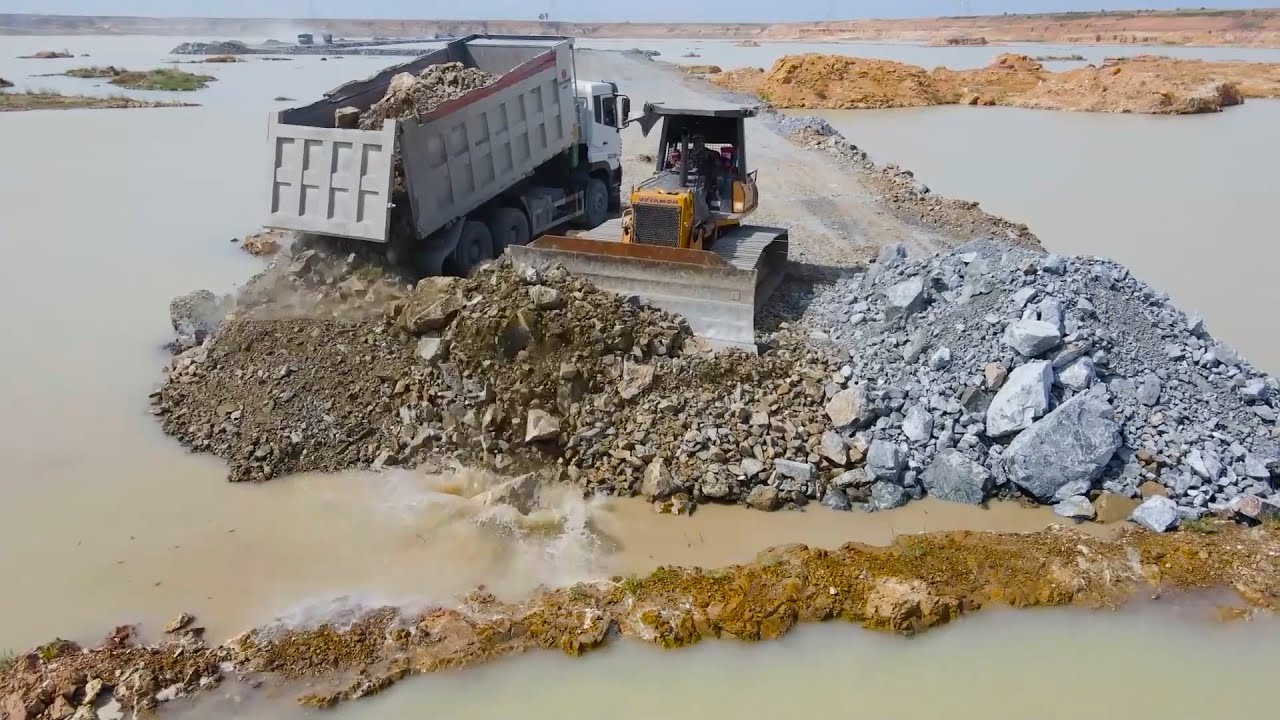 The Exquisite Architectural Surface Space in the Deep Pit is Landfill by Dump Truck and Bulldozer
