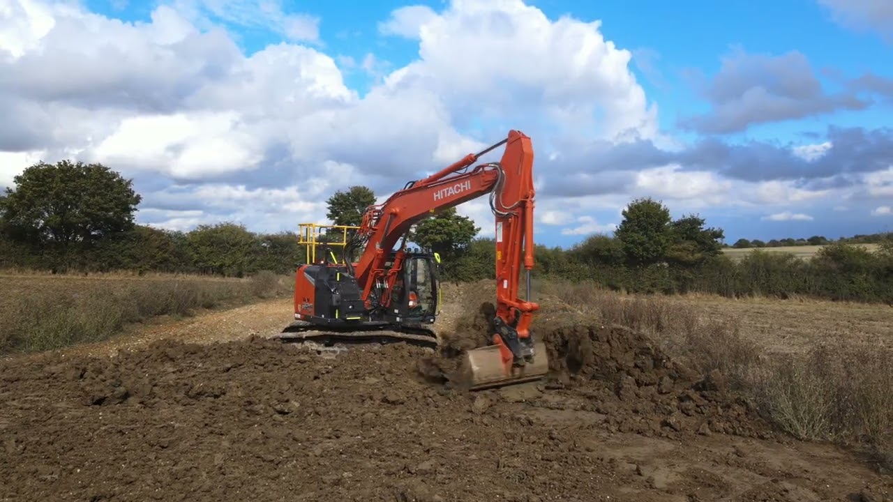 Laying topsoil field 4
