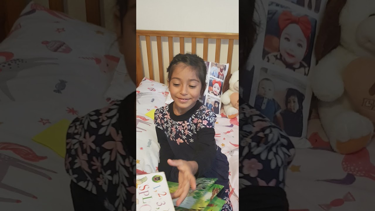 Bibi Amina listening to story in iPad